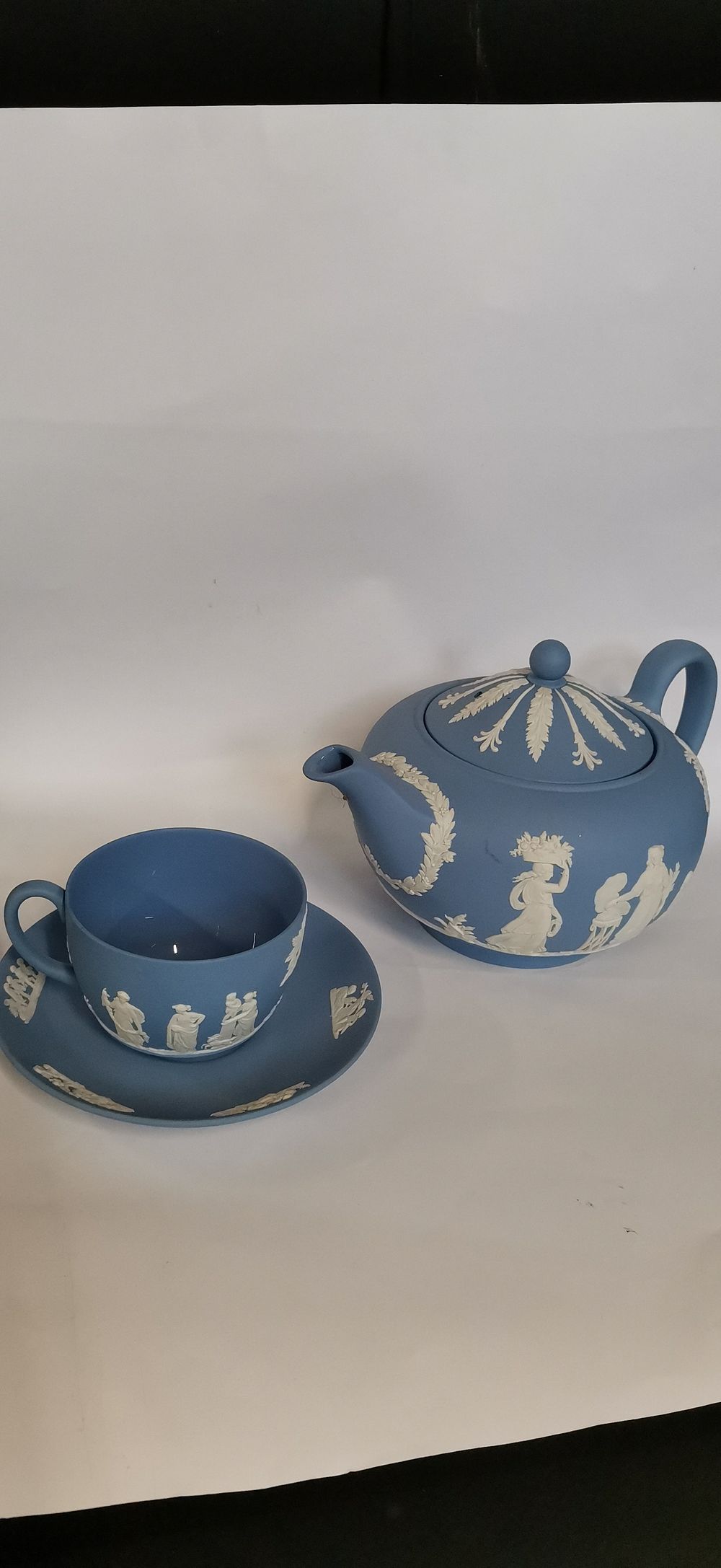 Lot 283: A Trio of Wedgwood Blue Jasperware Tea Items