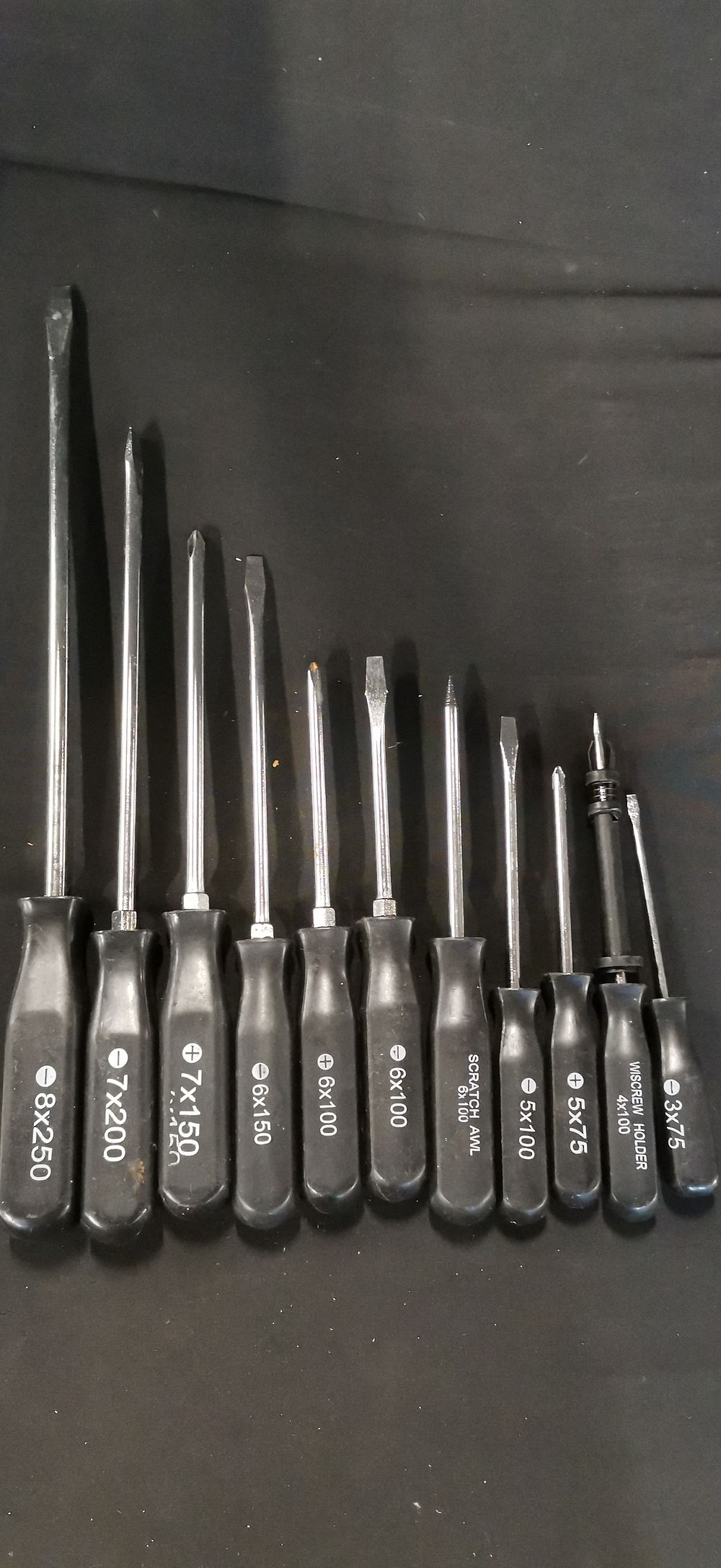 Lot 293: A Collection of Black Handled Screwdrivers and Hand Tools