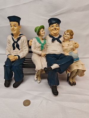 Laurel and Hardy Sailor Figurine Group on Bench, Circa 1990. This composite resin figurine group 