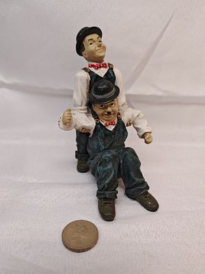 Laurel and Hardy Decorative Figurine, Hand-Painted Resin, Late 20th Century. A vintage 