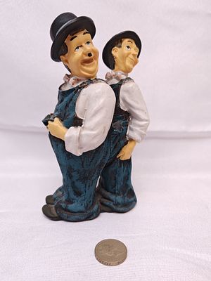 Laurel and Hardy Back-to-Back Resin Figurine, Late 20th Century. A hand-painted resin or 