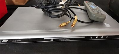 TOSUMI TOMMDVD599 DVD Player with Remote and Cables. A silver TOSUMI model TOMMDVD599 DVD player 
