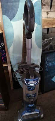Shark NV480UKR 26 Upright Vacuum Cleaner. A blue and grey Shark upright vacuum cleaner model 