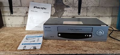 Pacific PV204 VHS Video Recorder with User Guides. A silver Pacific model PV204 VHS video 
