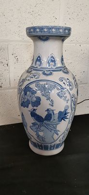 Chinese Blue and White Ceramic Vase with Avian Motifs. A blue and white ceramic vase decorated 