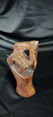 Abstract Hand Carved Wooden Sculpture. A hand-carved wooden sculpture featuring a stylized 