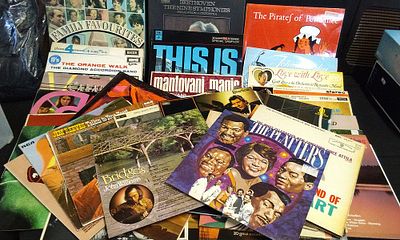 A Collection of Assorted Vinyl LP Records. A collection of multi-coloured vinyl records 
