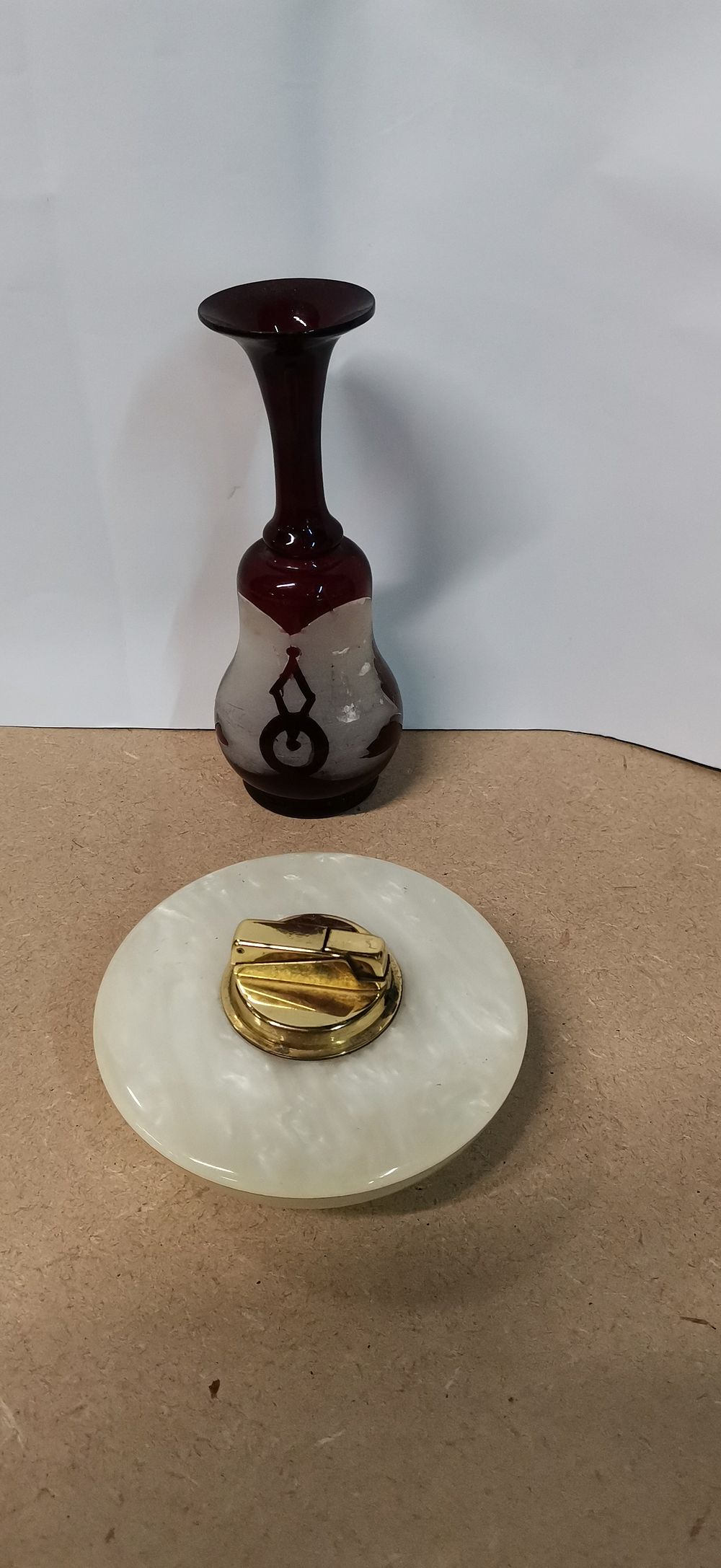 Lot 353: Two items comprising a ruby glass vase and table lighter