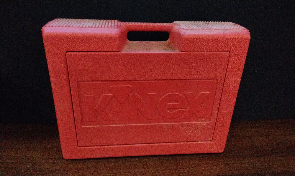 Lot 370: Red Knex Storage Box Containing a Selection of Knex Pieces