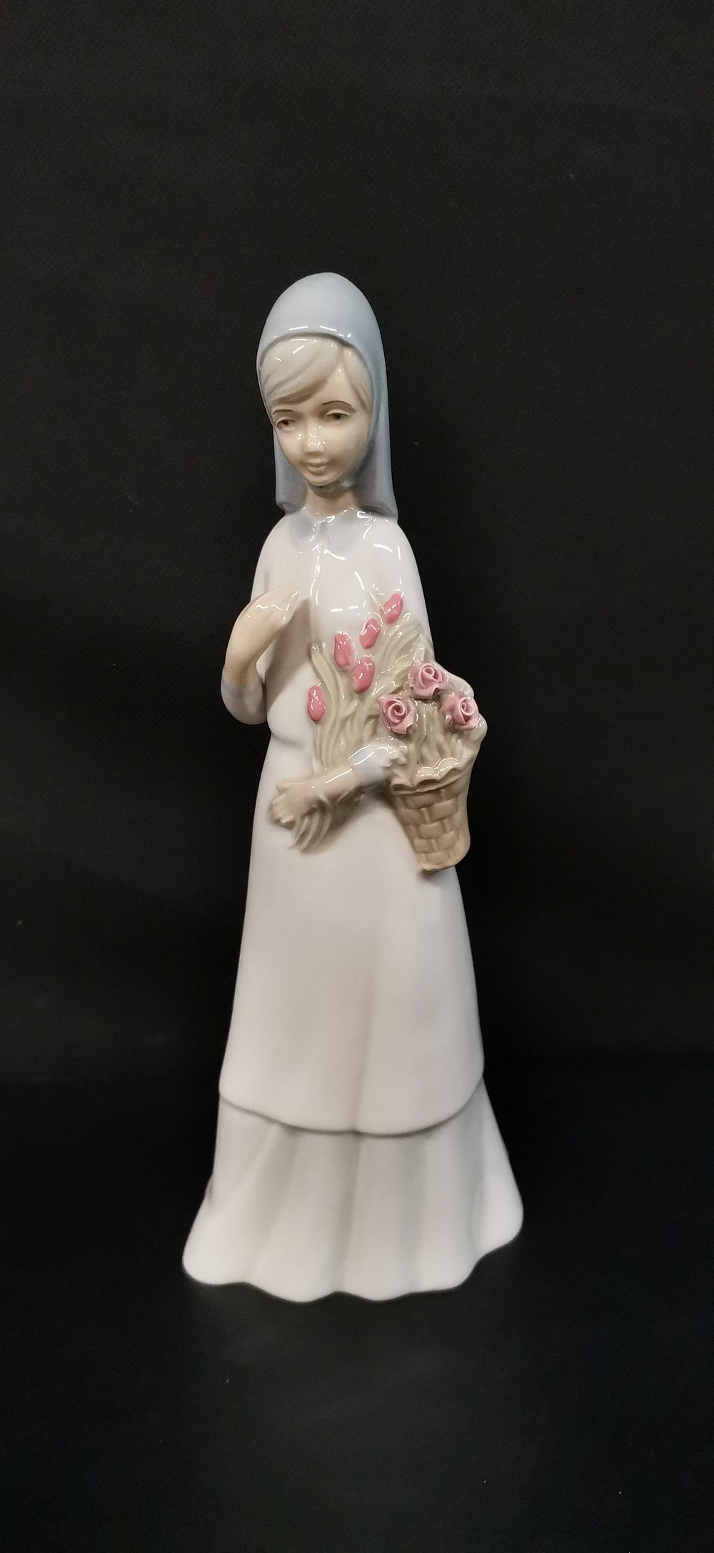 Lot 418: Miquel Requena Porcelain Figurine of a Woman with Flowers