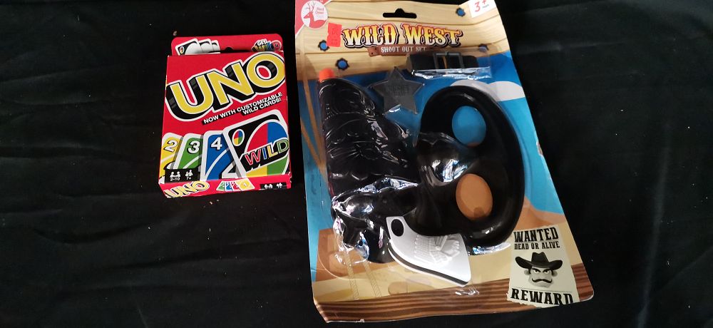 Lot 234: Two Toys Including Uno Card Game and Cowboy Set