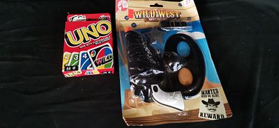 Two Toys Including Uno Card Game and Cowboy Set. A boxed Uno card game and a Red Deer Toys Wild 