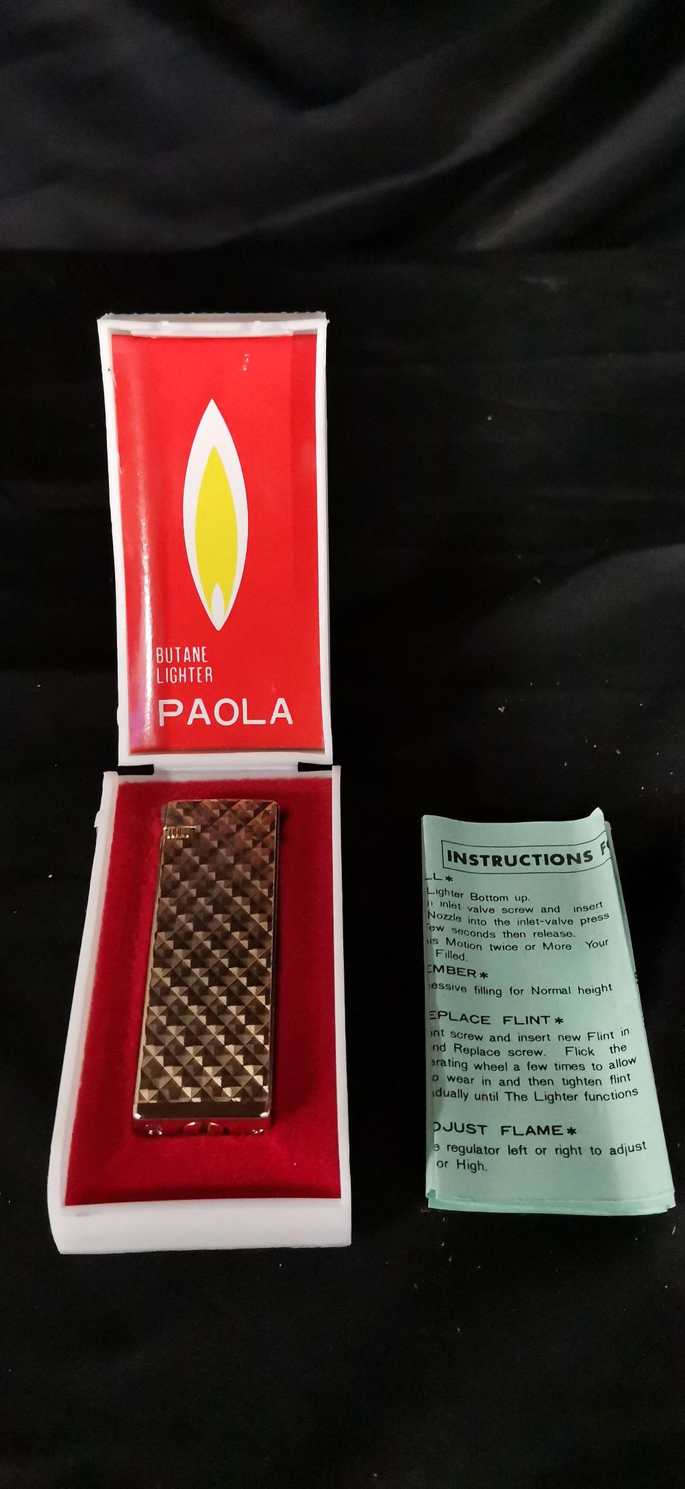 Lot 199: Paola Gold Tone Diamond Textured Butane Lighter with Case
