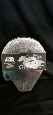 Paladone Star Wars Millennium Falcon 201 Piece Jigsaw Puzzle Tin. A silver Millennium Falcon 