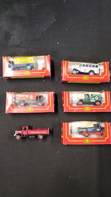 Six Corgi Cameo The Village Collection Die-cast Vehicles. Six multicoloured die-cast model 