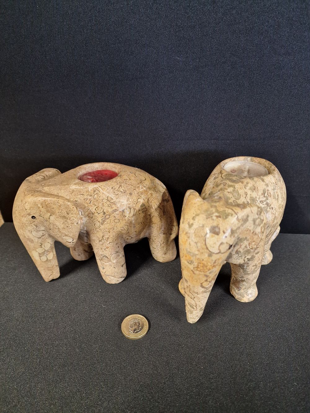 Lot 369: A Pair of Carved Stone Elephant Tea Light Holders