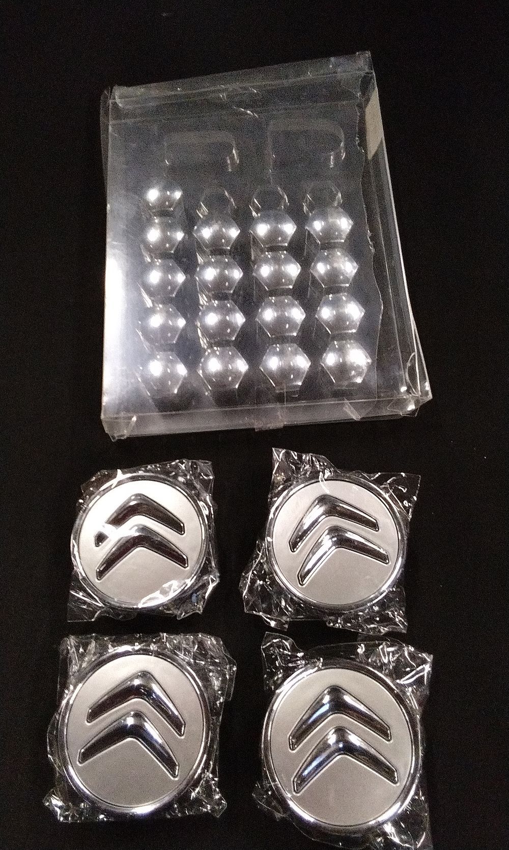 Lot 394: A Collection of Citroen Chrome Wheel Centre Caps and Nut Covers