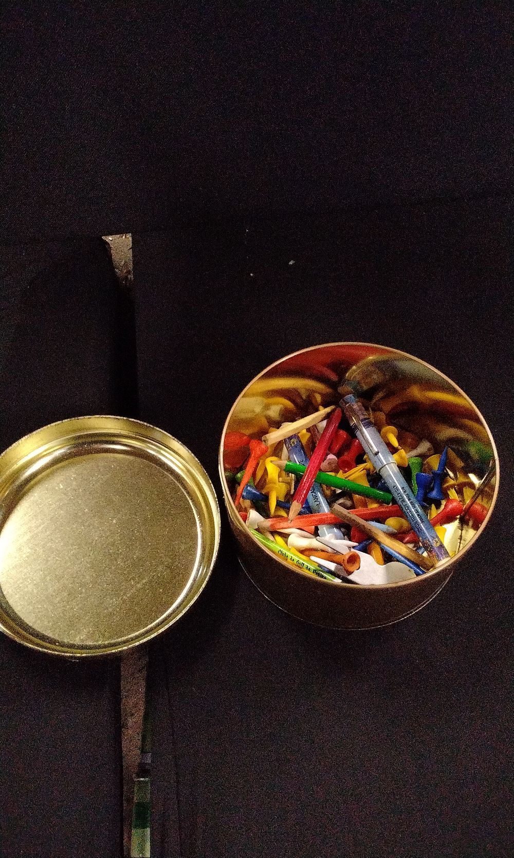 Lot 395: A Collection of Assorted Golf Tees and Pencils in Tin