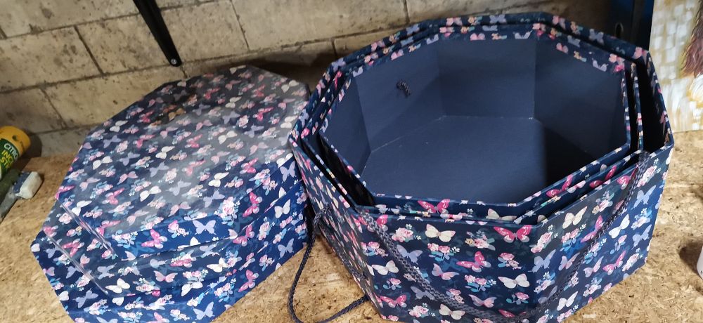Lot 396: A Collection of Blue Floral Octagonal Nested Storage Boxes