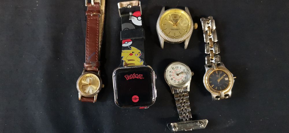 Lot 303: A Collection of Analog and Digital Wristwatches