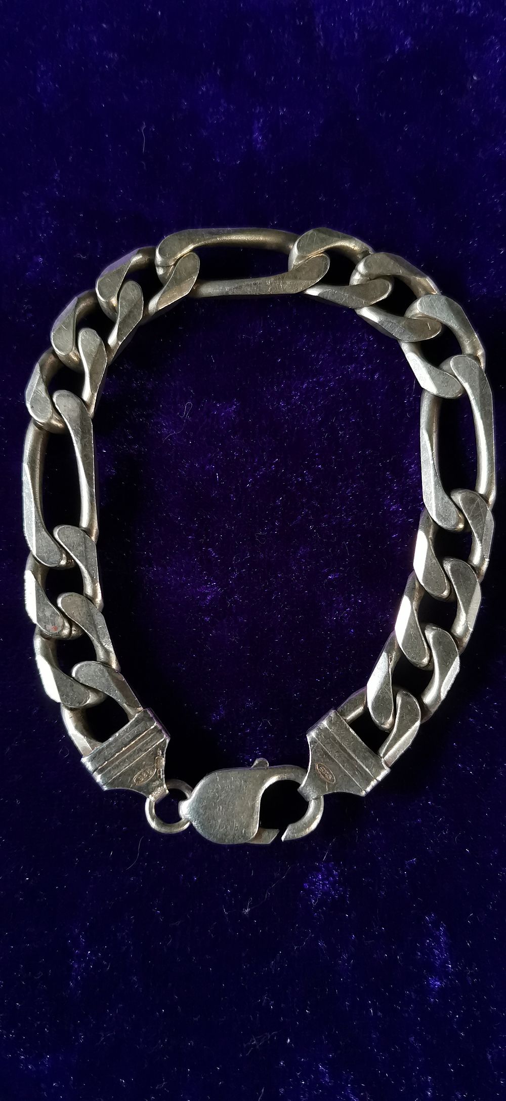 Lot 307: Sterling Silver Figaro Link Bracelet.