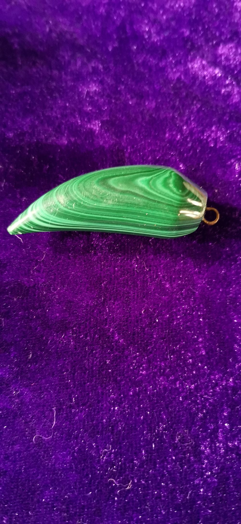 Lot 311: A Banded Malachite Horn Pendant