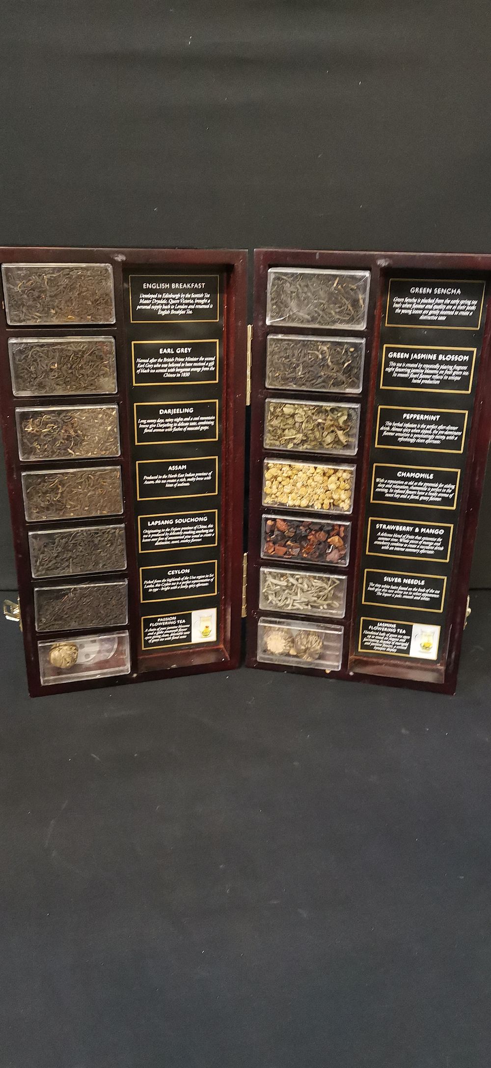 Lot 357: A Collection of Tea Samples in a Wooden Display Case