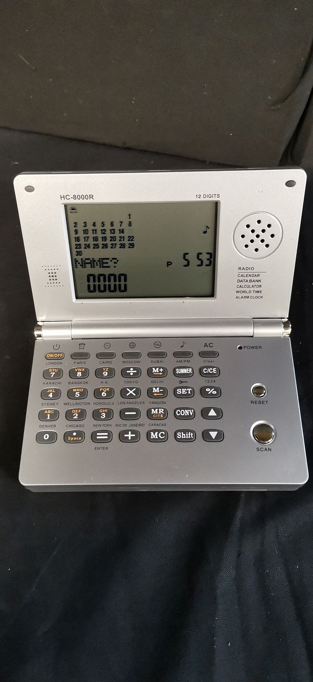 Lot 377: HC-8000R Multi-function Radio Calculator and World Time Clock