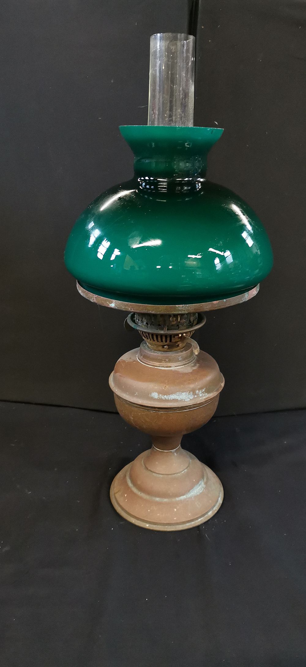 Antique Style Oil Lamp with Green Cased Glass Shade. An antique-style oil lamp featuring a deep 