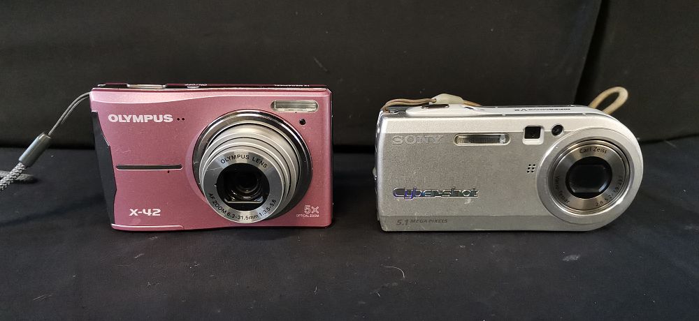 Lot 394: Two Olympus and Sony Digital Point and Shoot Cameras