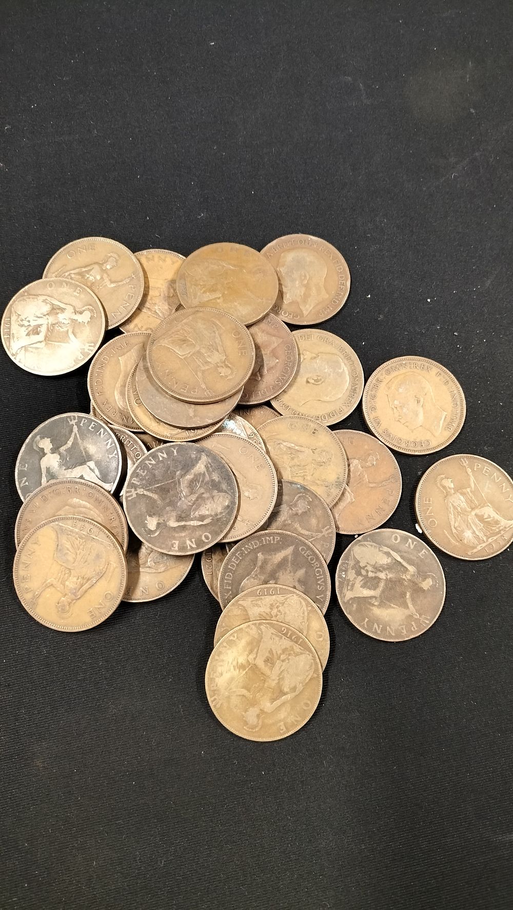 Lot 307: 30 King George V British One Penny Coins