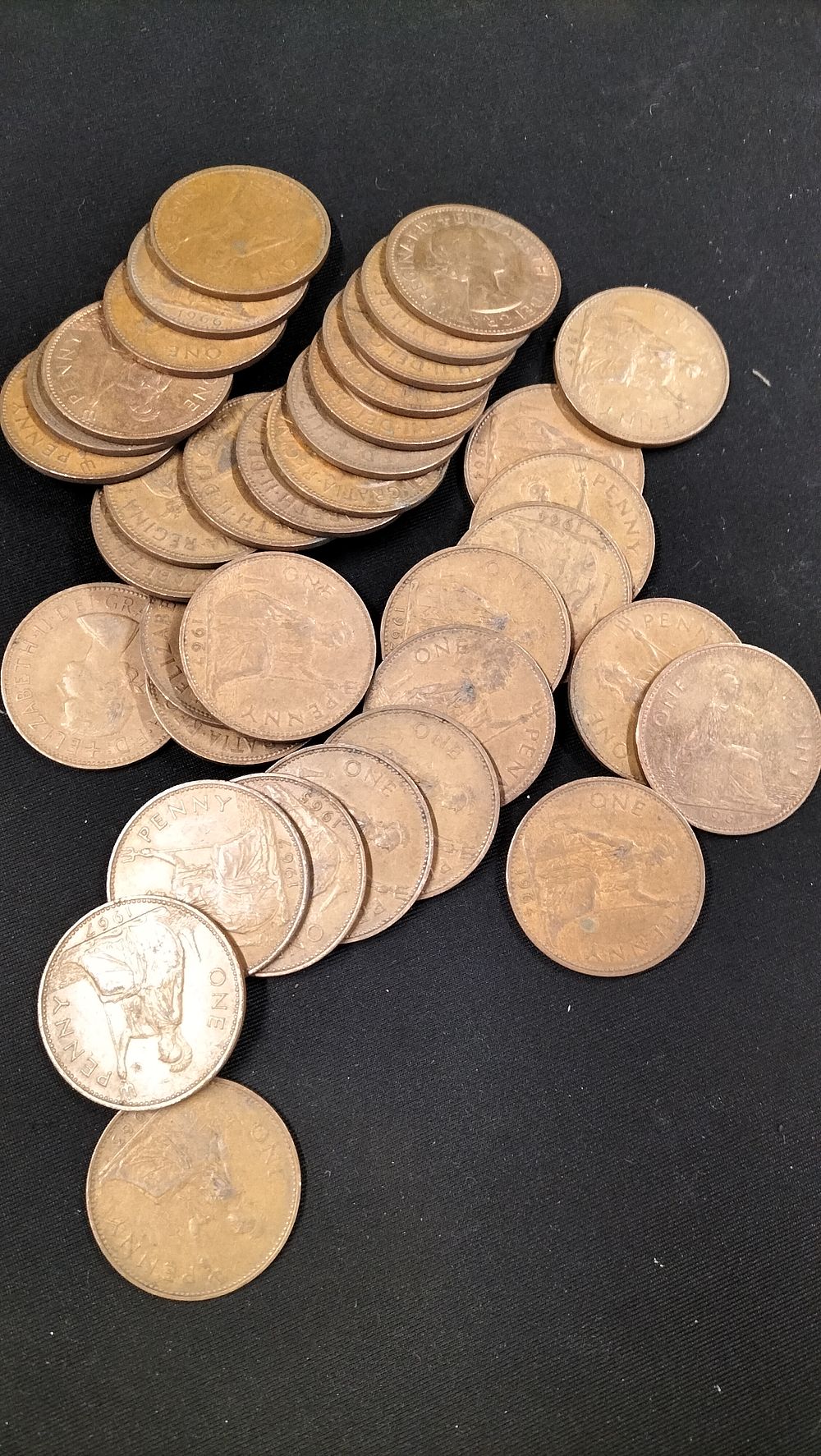 Lot 308: 30 Queen Elizabeth II British One Penny Coins
