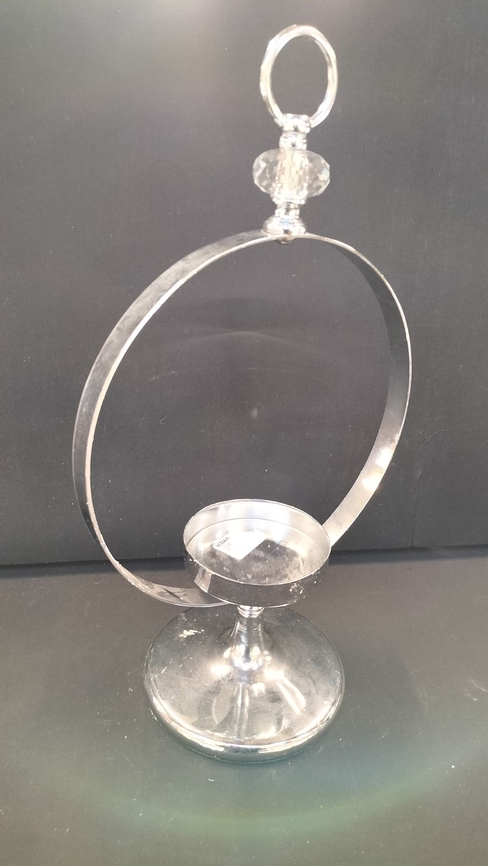 Lot 311: Silver Toned Circular Ring Candle Holder with Faceted Detail