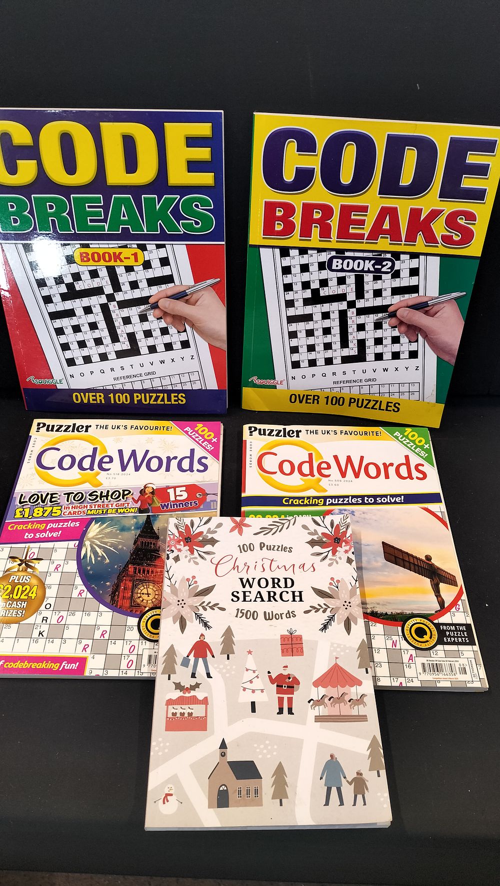 Lot 328: Five Code Break and Word Search Puzzle Books