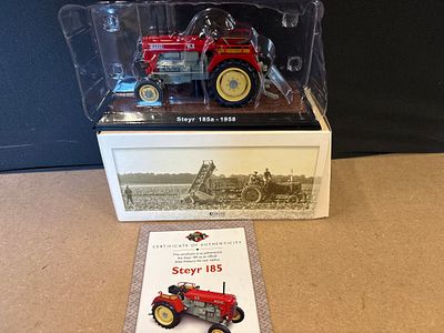 Atlas Editions Steyr 185a 1958 Die-Cast Model Tractor. A red and grey Atlas Editions die-cast 