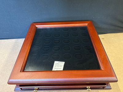 Wooden Sacagawea Dollar coin collector display case. A reddish-brown wooden coin collector 
