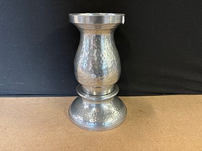 Hammered Alloy Pillar Candle Stand. A single silver-coloured alloy pillar candle stand featuring 