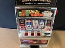 A Plastic Toy Slot Machine Bank with Red Accents. A plastic toy slot machine bank featuring a Image - 1