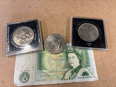 A Collection of Four British Commemorative Coins and Banknote. A collection of four items 