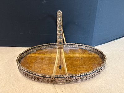 Vintage Woven Cane and Wood Oval Basket Tray with Tall Handle. An oval basket tray featuring a 