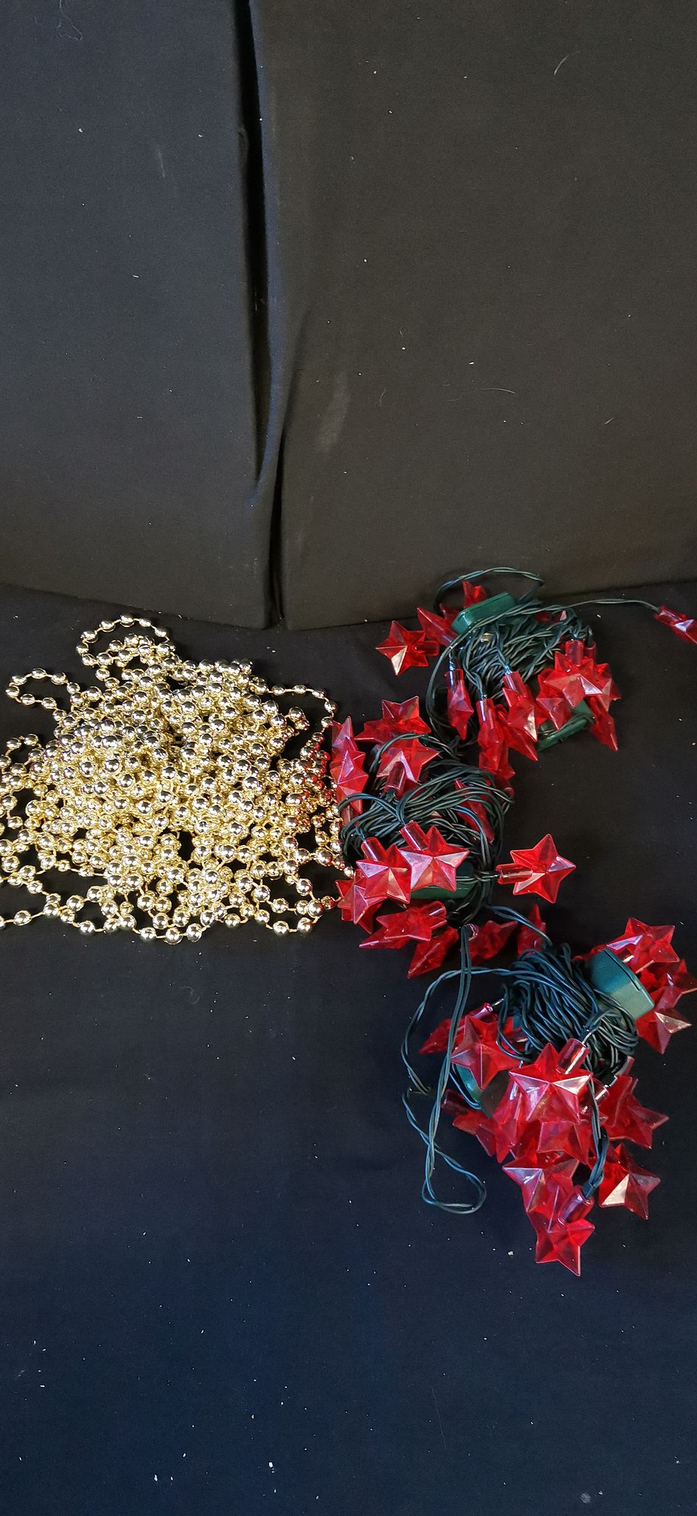 Lot 263: A Collection of Red Star String Lights and Beaded Garland