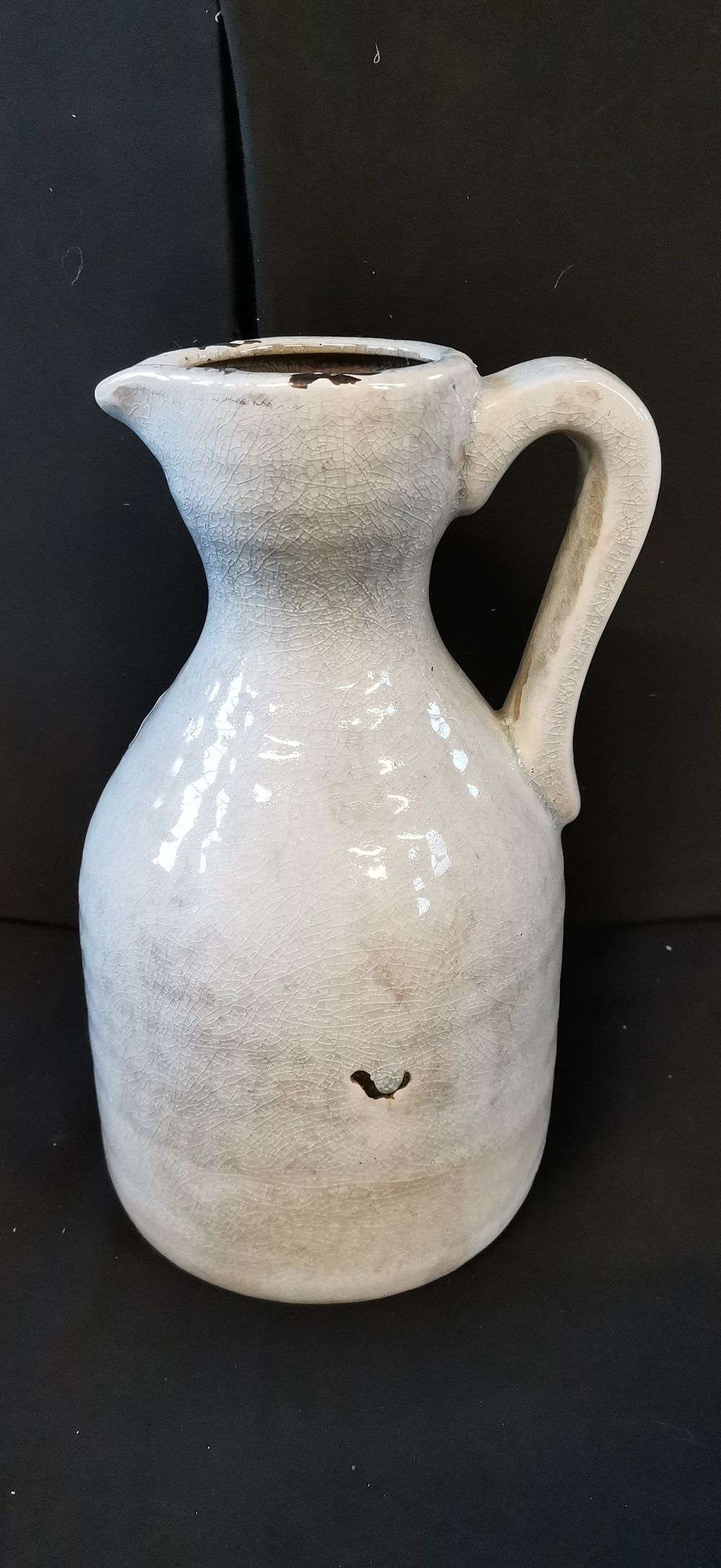 Lot 272: Off-white ceramic pitcher with heavy crackle glaze finish