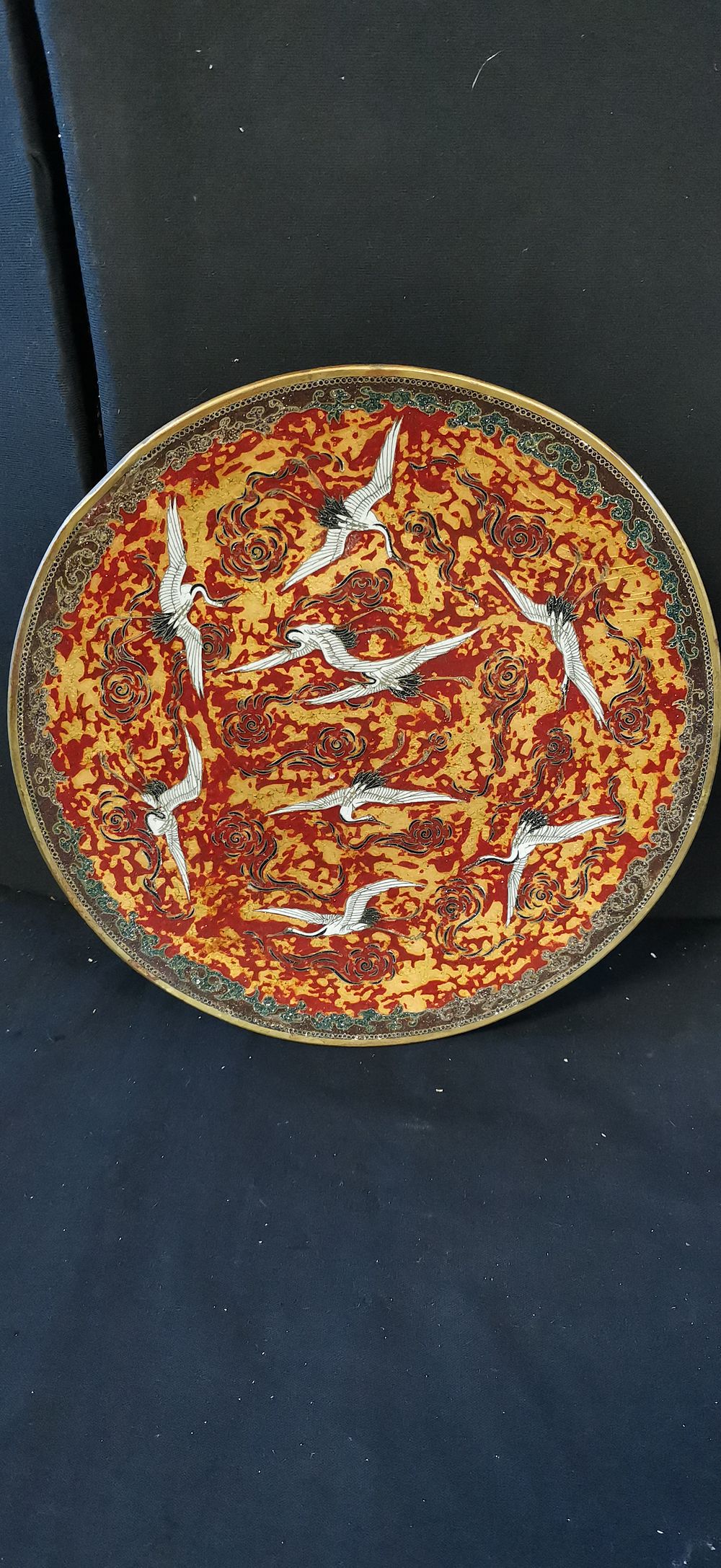 Lot 273: A Cloisonné Charger with White Cranes on Red Ground