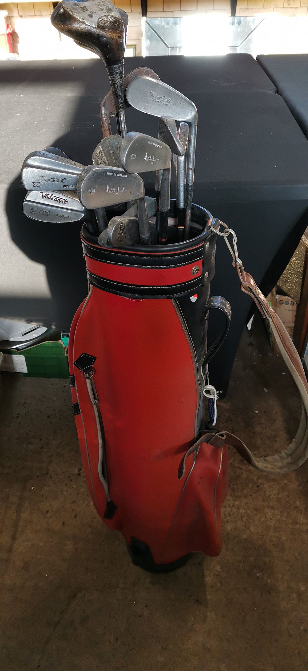 Lot 426: A Collection of Vintage Golf Clubs in a Red Bag