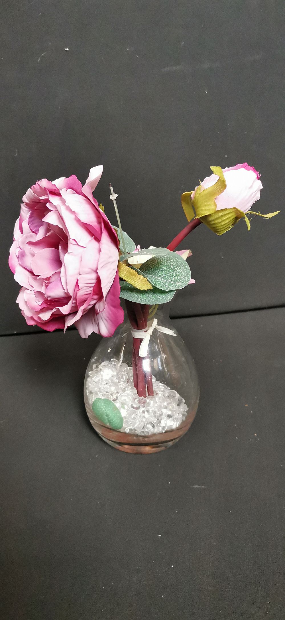 Lot 435: Artificial Pink Floral Arrangement in a Glass Bud Vase