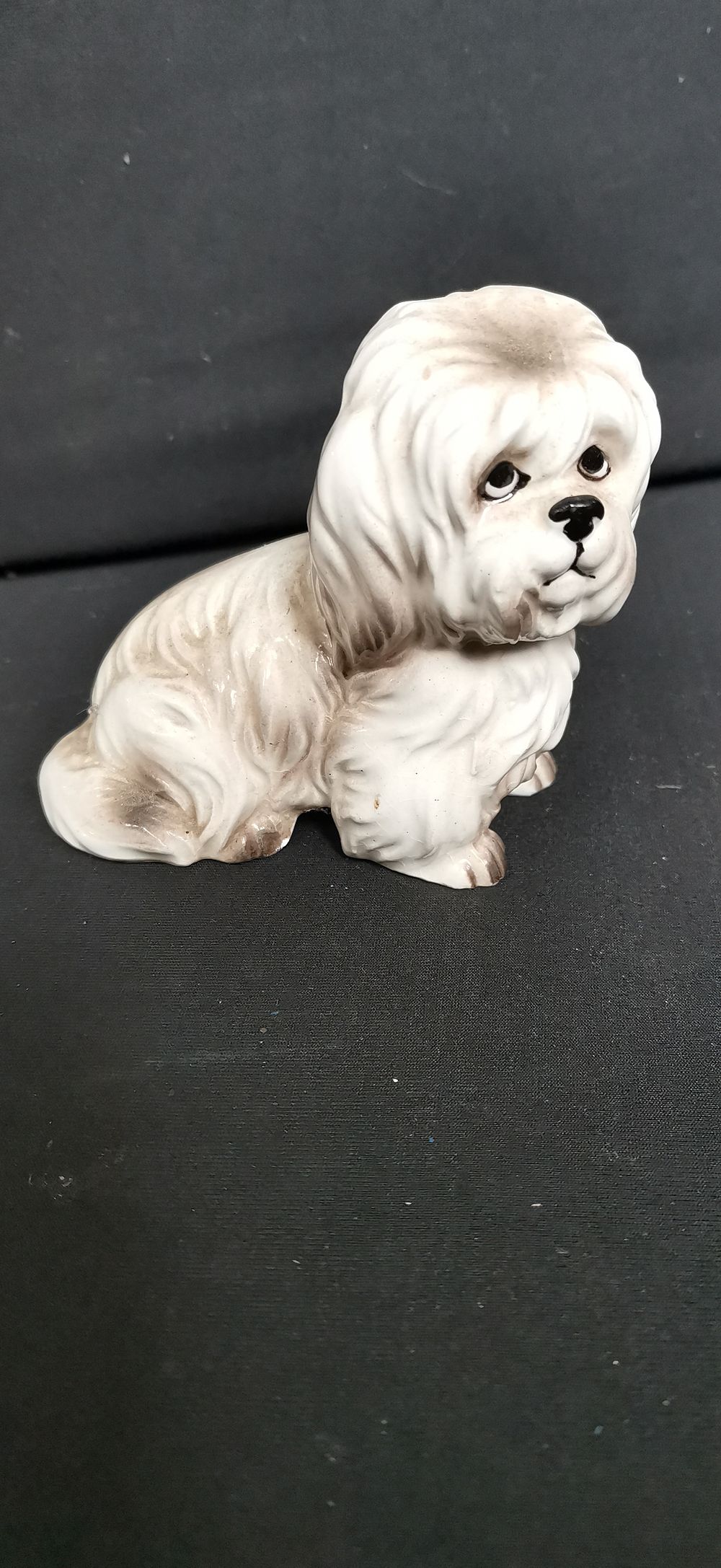 Lot 439: Ceramic long haired dog figurine marked Foreign