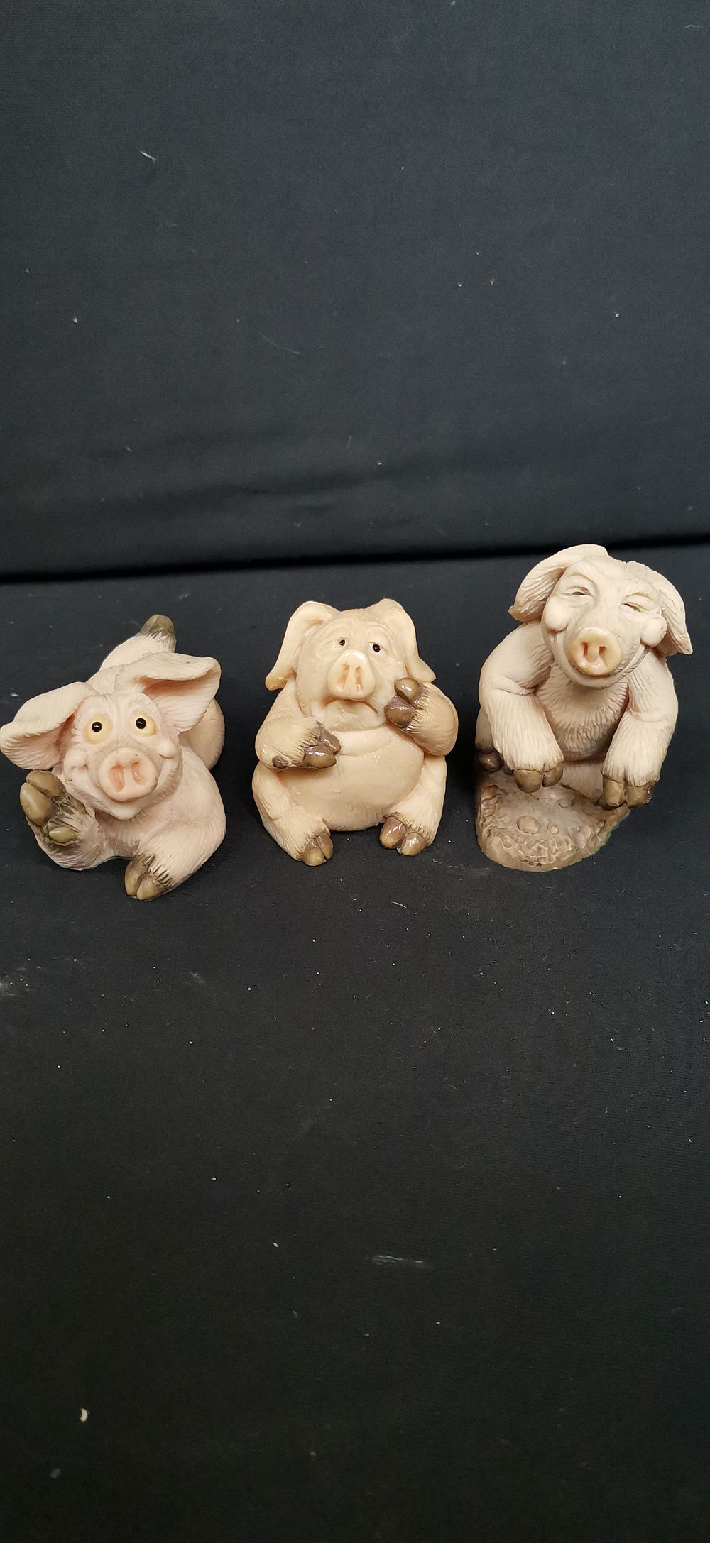 Lot 453: A Trio of Light Pink and Beige Pig Figurines