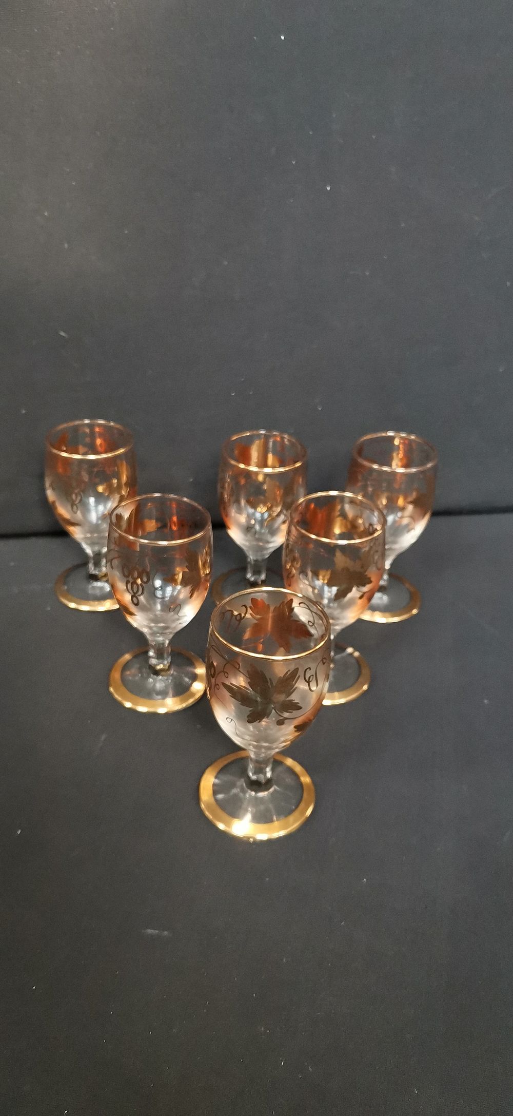 Lot 468: A Collection of Gold-rimmed Grape and Leaf Cordial Glasses