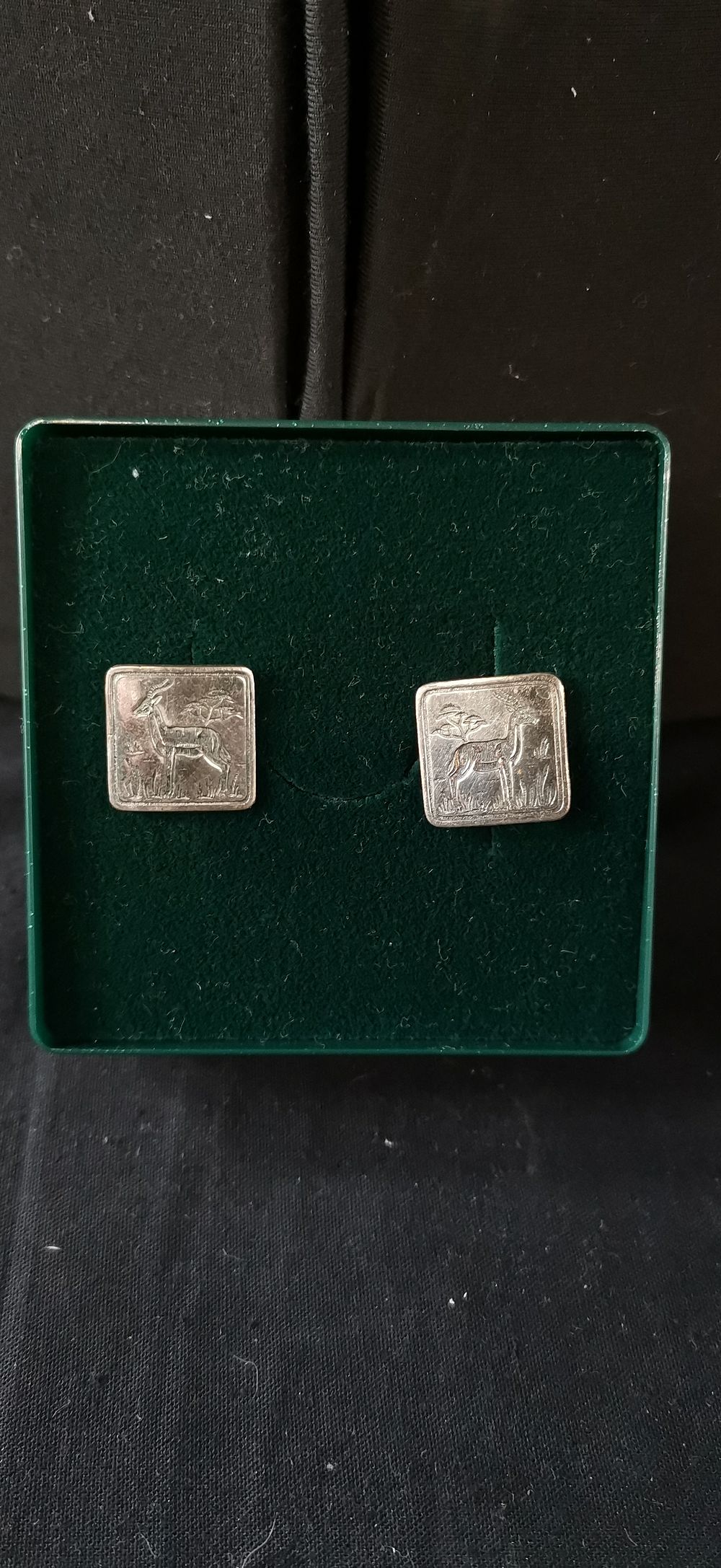 Lot 317: A Pair of Silver Toned Antelope Design Cufflinks