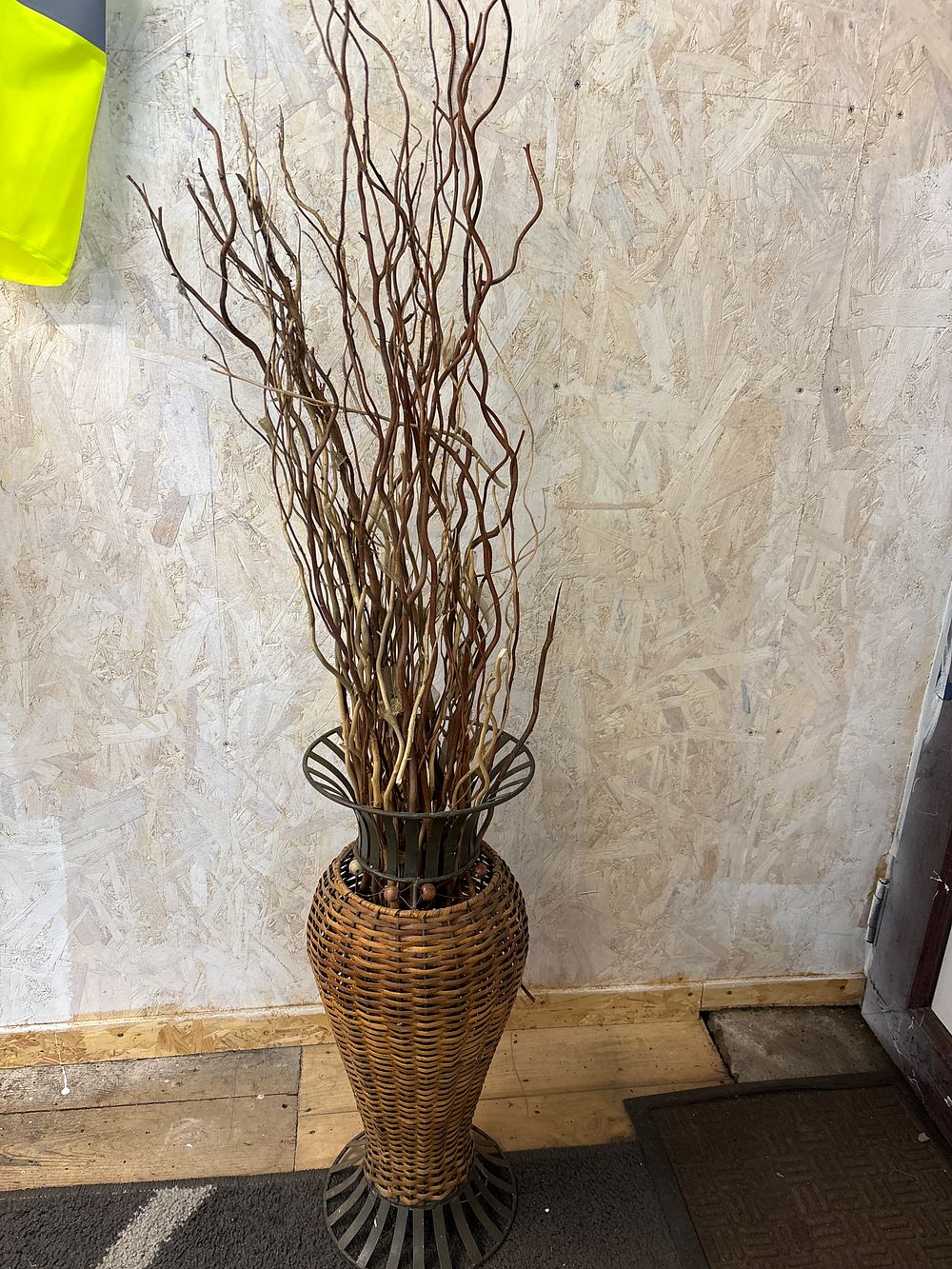 Lot 184: A Rustic Woven Wicker and Metal Floor Display Vase with Willow Branches
